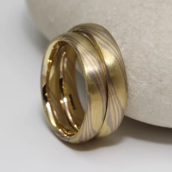 The Hayakawas: Yellow Gold Mokume Gane Wedding Ring with White Gold and Rose Gold