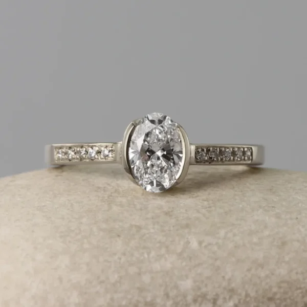 The Faughan: 18ct White Gold Partial Collet Oval Diamond or Moissanite Engagement Ring with Pave Set Shoulders