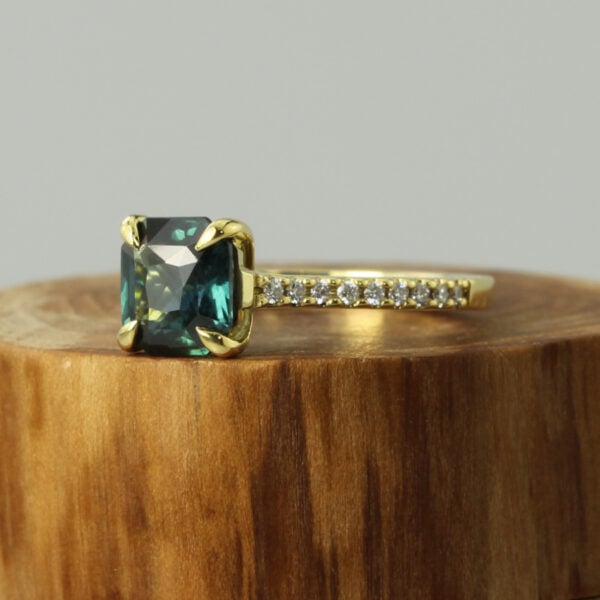The Doe: 18ct Gold Teal Emerald Cut Sapphire and Diamond Engagement Ring