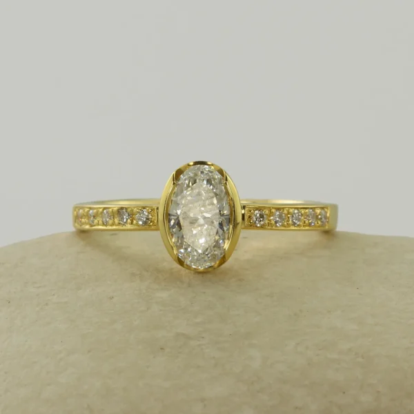 The Faughan: 18ct Yellow Gold Partial Collet 0.77ct Oval Lab Grown Diamond Engagement Ring with Pavé Set Shoulders