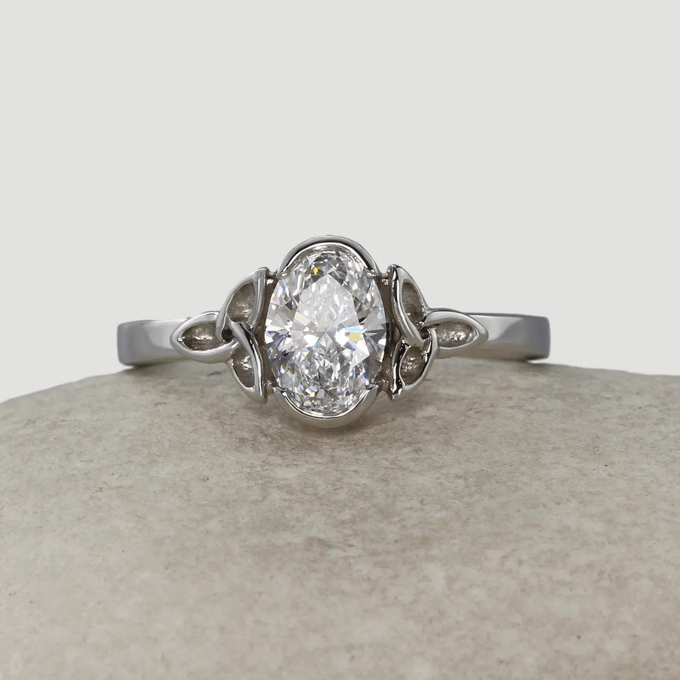 Ethical platinum and Celtic knot oval diamond engagement ring