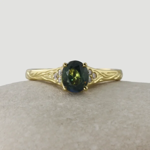 The Conwy: 18ct Yellow Gold Forest Canopy Engraved Oval Teal Sapphire Engagement Ring with Flush Set Diamond or Moissanite Shoulders